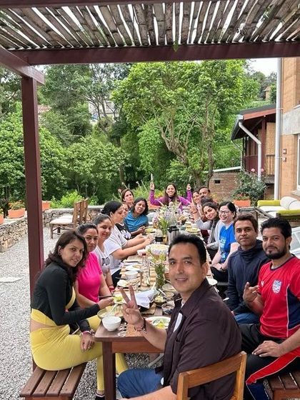 Sharing a meal together in the beautiful, lush surroundings of our Nepal retreat center.