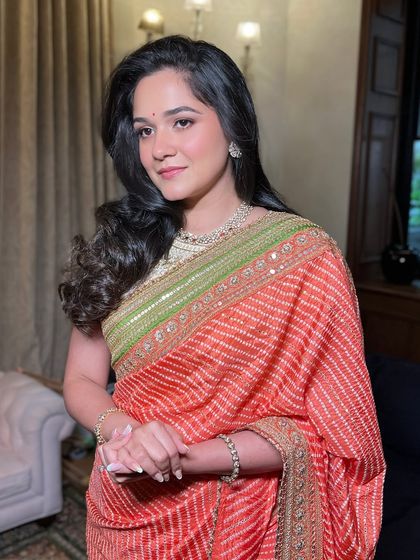 A softer, more traditional look for another event. Here, the sister of the bride wears a beautiful bandhani saree, and I've paired it with classic makeup, soft curls, and a radiant complexion.