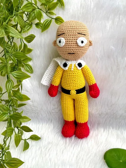 Saitama from One Punch Man! This doll captures his simple yet iconic yellow suit, red gloves, and classic unimpressed expression. It was fun to see the joy this brought to a fan.