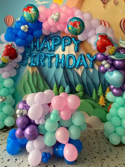 Another look at our mermaid balloon arch, featuring "Happy Birthday" foil letters and Ariel character balloons.