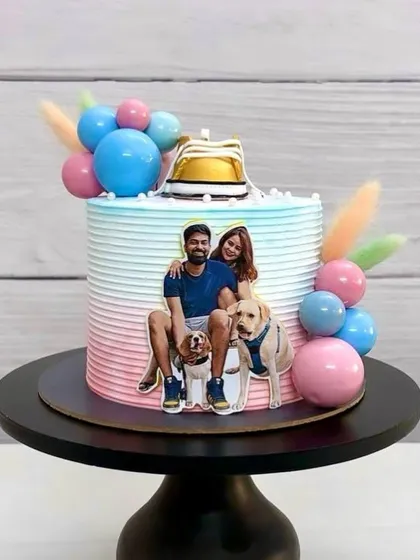 Another angle of the adorable parents-to-be cake, showing the pastel ombre frosting and cute sneaker topper.