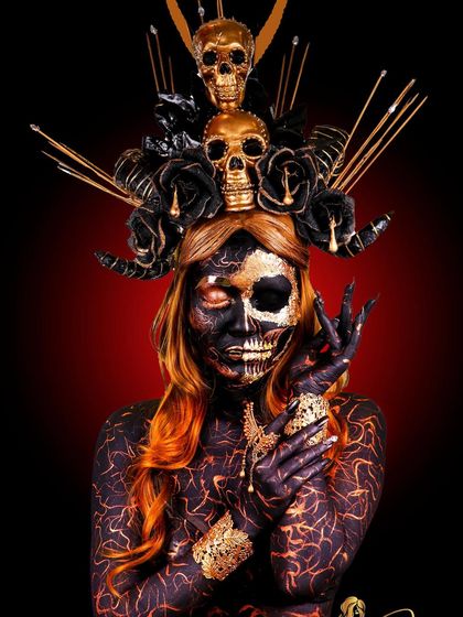 We witch you a Happy Halloween. This look is a deep dive into creative and SFX makeup, featuring body paint, gold leaf, and a custom-made skull headpiece.