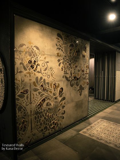 A textured wall with a large-scale paisley mosaic. This is an example of how we turn walls into art, telling stories in texture, pattern, and light.