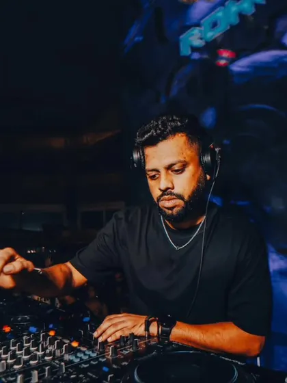 Focused and in the zone. Behind the decks is where I blend my signature sound, mixing everything from hip hop and house to techno and Afro House to match the crowd's energy.