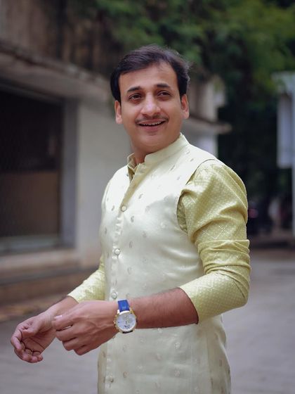 A happy and welcoming portrait of Sankarshan Karhade in his styled outfit for the show.