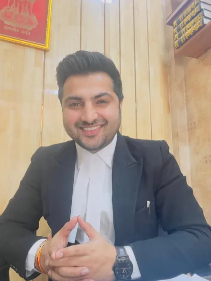 A confident smile from my office, used during my campaign to connect with my peers.
