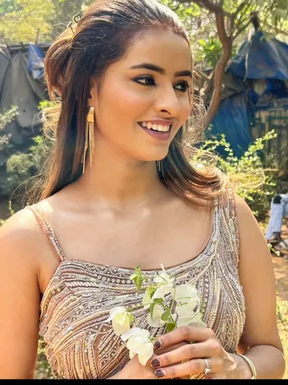 A happy client in a beautiful bronze-colored gown, perfect for an outdoor photoshoot.