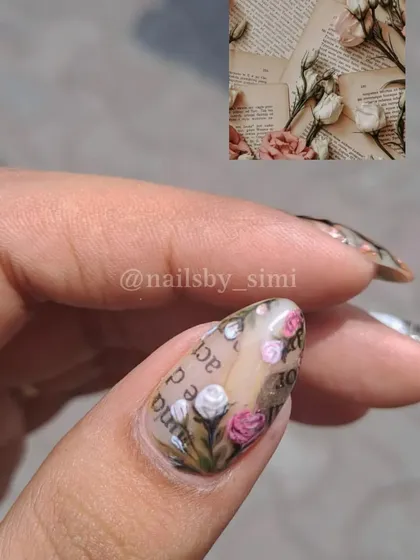 Inspired by vintage aesthetics, this nail features tiny hand-painted roses over a background that looks like old book pages.