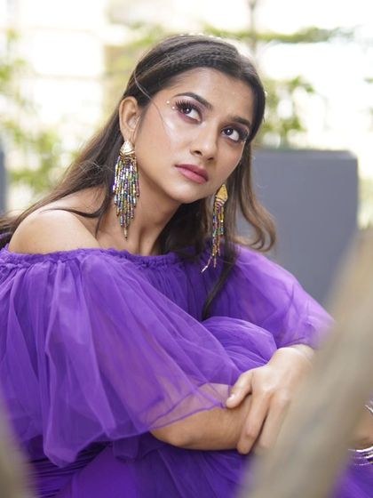 A softer, more candid moment from the shoot. The makeup looks just as flawless up close, with a focus on radiant skin and beautifully defined eyes that convey a sense of modern romance.