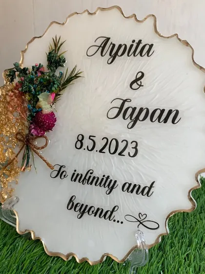 A romantic keepsake for a couple, this frame includes their names, a special date, and a meaningful quote. A bouquet of preserved flowers adds a beautiful 3D element.