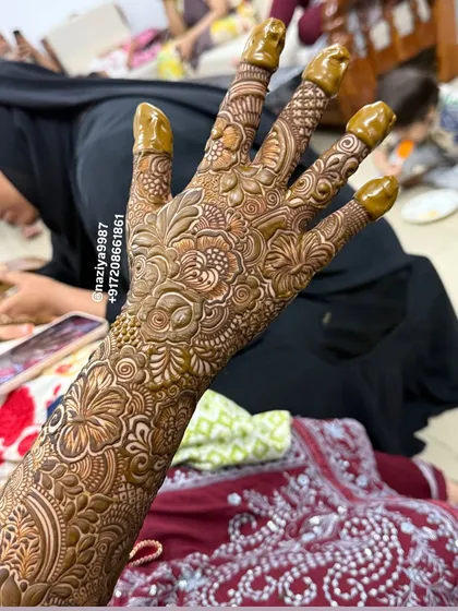 Another view of the back-hand bridal design, showcasing the intricate work that goes into each finger.