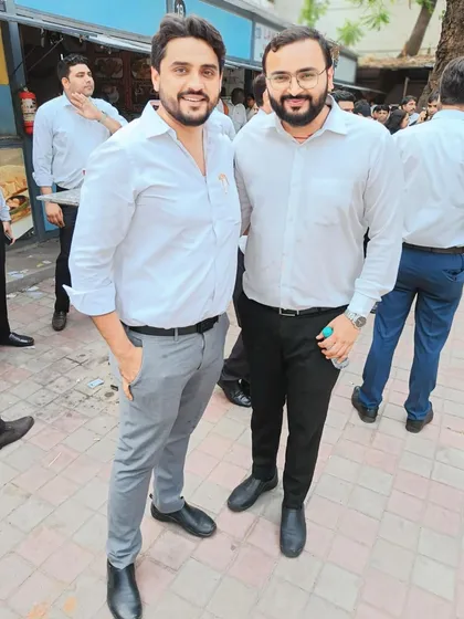 A simple, warm moment with a colleague. These personal connections are the bedrock of our professional lives.