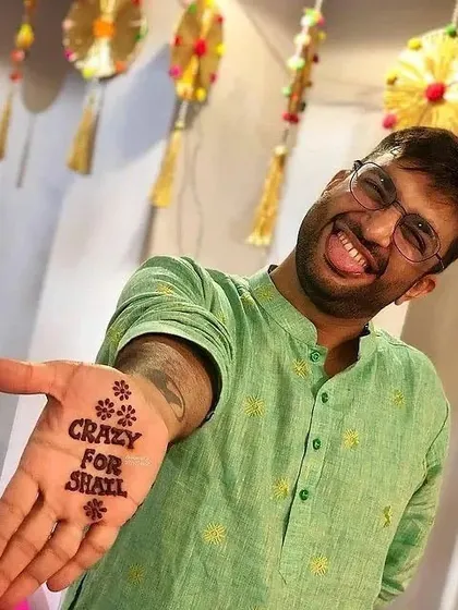 Sometimes, a simple message says it all. This fun and bold mehandi for the groom clearly expresses his excitement and love for his bride-to-be.