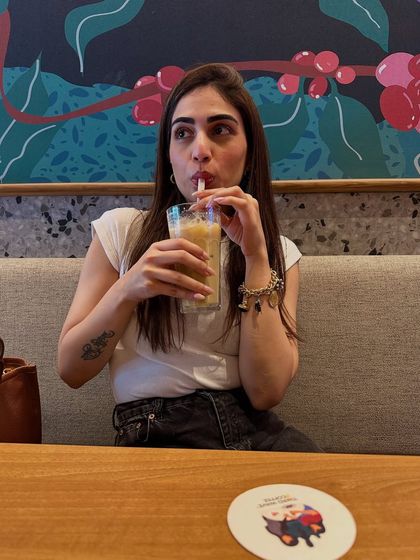 Fully focused on my iced coffee. A simple white t-shirt and jeans is the perfect outfit for a casual coffee date with myself.