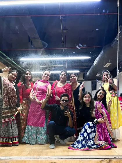 A happy moment captured in the studio mirror after a successful Garba class. It's wonderful to see everyone enjoying themselves and embracing the festive spirit.