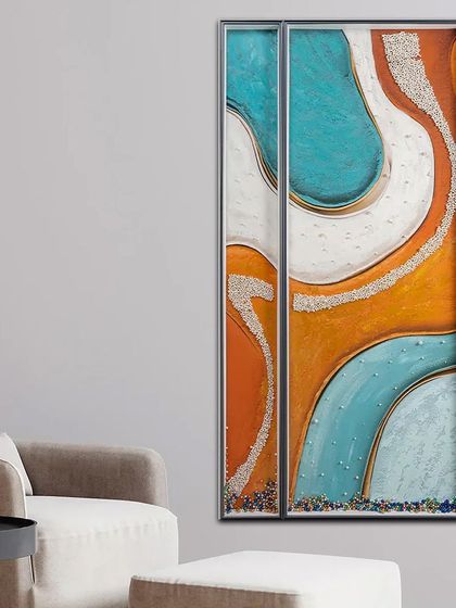 This set of two abstract paintings uses a fresh palette of teal, orange, and white. The textured surface is embedded with small crystals, adding a subtle sparkle to the modern design.