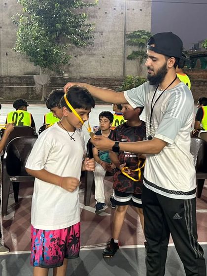 Another player from the U-10 match receives his medal. I believe in recognizing every single player's contribution to the team.