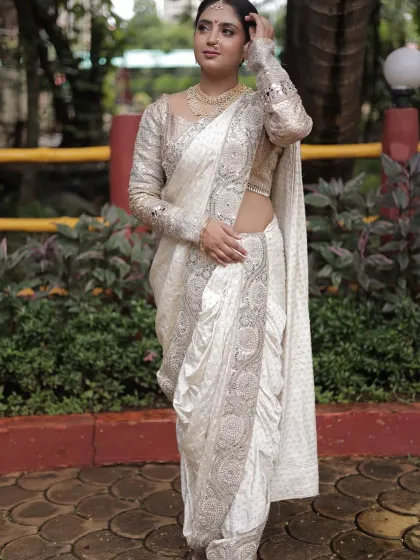 Embracing my Maharashtrian roots with this elegant white Nauvari saree. The unique dhoti-style drape and detailed silver work offer a beautiful blend of tradition and modern grace.