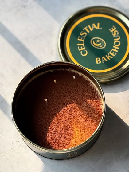 Sunlight catching the cocoa powder on our Tiramisu. We even add a touch of edible gold for that extra special feel.