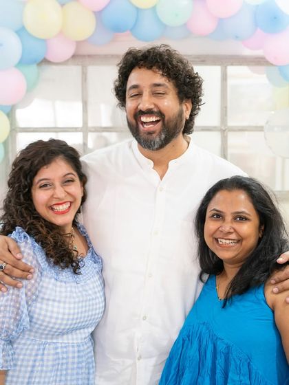 A baby shower is also about celebrating with the friends who are your family. This photo captures the genuine smiles and supportive friendships that are such an important part of the journey.