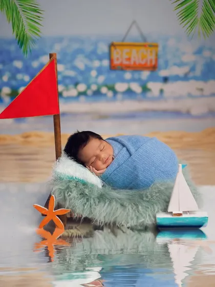 Another view of the beach baby setup, featuring a miniature sailboat and a reflection that creates a realistic water effect.