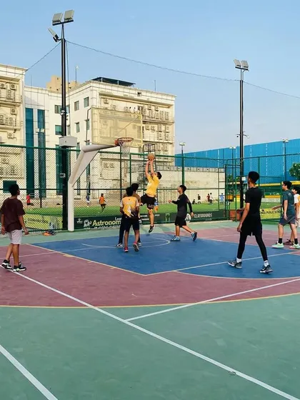 A player goes up for a layup in traffic. This shows the confidence and skill we build in our athletes.