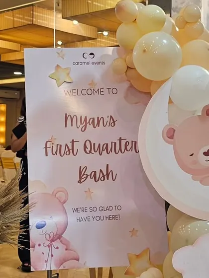 The personalized welcome sign for the celestial-themed party, decorated with matching graphics and a small balloon arrangement.