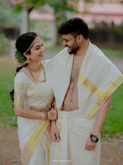 A happy and relaxed portrait of the couple after their temple ceremony, their smiles reflecting the joy of their union.