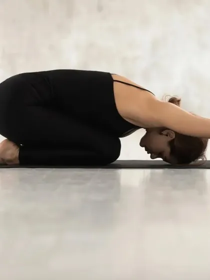 The Child's Pose, or Balasana, is a restorative posture that gently stretches the back, hips, and shoulders. It is an excellent pose for relieving tension and calming the mind.