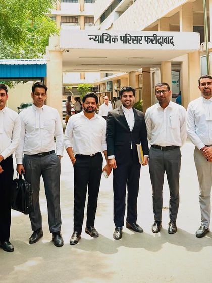 My team and I outside the Nyayik Parisar in Faridabad after a productive day. We successfully secured bail for a client facing charges under IPC 420 and 120, a testament to our collaborative efforts.