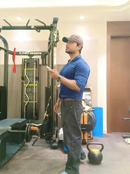 Taking a moment between sessions at the gym. A trainer's job involves planning, observation, and constant learning.
