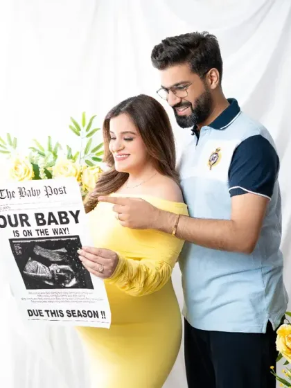 Breaking news! This fun and creative announcement shot features the couple reading a custom newspaper that shares their exciting baby news.
