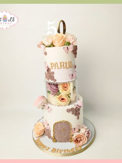 A floral fairytale for a 50th birthday. This unique tiered cake features a separator filled with beautiful roses, creating a magical floating garden effect.