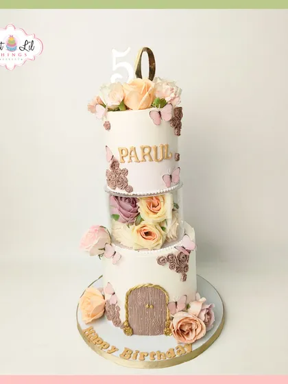 A floral fairytale for a 50th birthday. This unique tiered cake features a separator filled with beautiful roses, creating a magical floating garden effect.