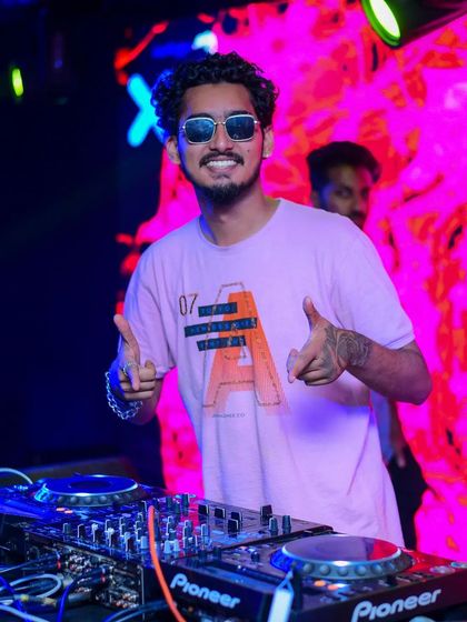 A happy moment behind the decks. I genuinely love what I do, and I think it shows.