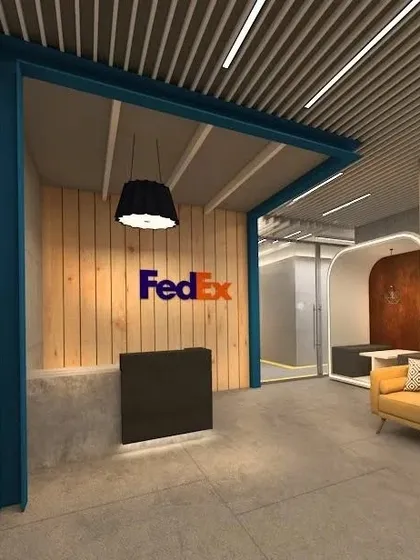 For FedEx, I redesigned the reception experience with an industrial-chic aesthetic. The design uses raw concrete, wood planking, and the brand's signature colors to create a dynamic and modern entrance.