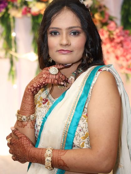 A portrait of a client after her mehendi has stained, looking elegant and ready for the main event.