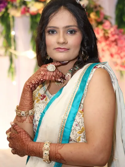 A portrait of a client after her mehendi has stained, looking elegant and ready for the main event.