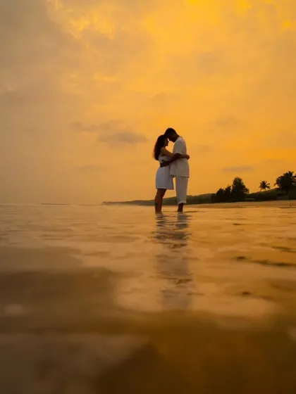 A pre-wedding shoot against a magnificent sunset sky. These sessions are about capturing your chemistry in a beautiful landscape, creating memories before the big day.