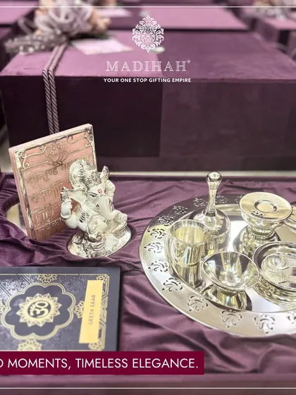 Sacred moments deserve timeless elegance. This Pooja hamper is one of my most heartfelt creations, combining a silver-plated thali set, a beautiful Ganesha idol, and other spiritual elements in a luxurious keepsake box. It is a perfect offering for blessed beginnings.