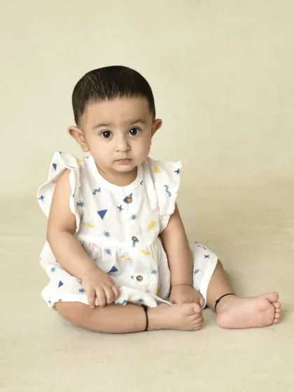 A collection of simple, classic portraits of twin babies. Without props or themes, their individual expressions and connection are beautifully highlighted.