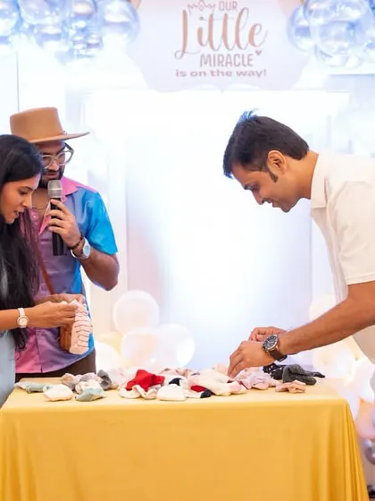Guests participating in a sock-pairing game. It’s a simple, fun challenge that fits perfectly with the baby theme.