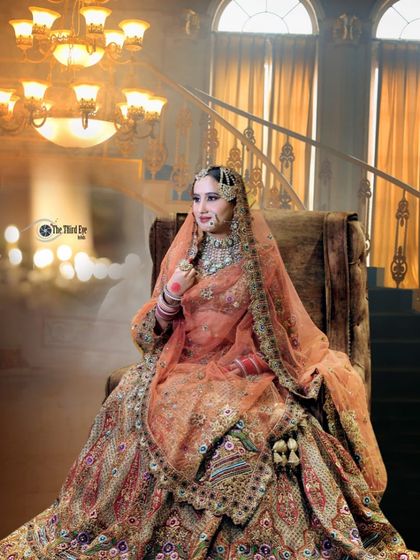 A royal bridal portrait. Our client looks like she's straight out of a painting in this heavily embroidered peach lehenga.