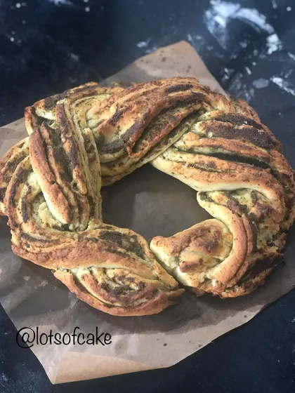 I call my pesto babka an 'Italian chutney' bread. It's a savory twist on the classic, with layers of fresh basil pesto swirled through the soft, braided dough.