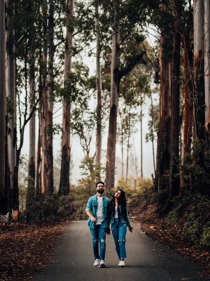 Your love story is an adventure, and we're here to follow you wherever it leads. This pre-wedding shoot in a majestic forest setting shows our passion for capturing couples in breathtaking natural landscapes.