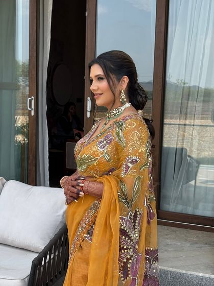 Another view of the braided messy ponytail. The combination of the neat braid on top and the relaxed waves in the tail creates a beautiful balance.