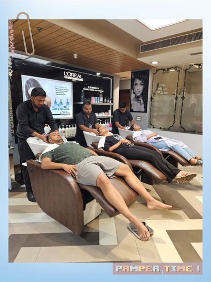 A shot of our busy hair wash station, with multiple clients enjoying a relaxing hair spa treatment simultaneously. It's a testament to the popularity of our pampering services.