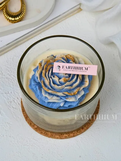 A closer look at the blue and gold peony candle. I love how the gold detailing catches the light, making it a truly special piece.