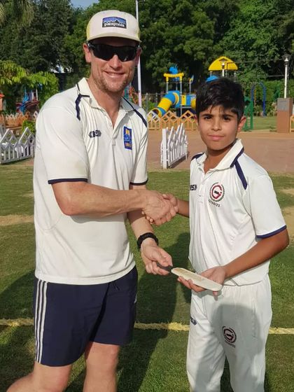 My young player shaking hands after a competitive and friendly match. This is how they learn sportsmanship.