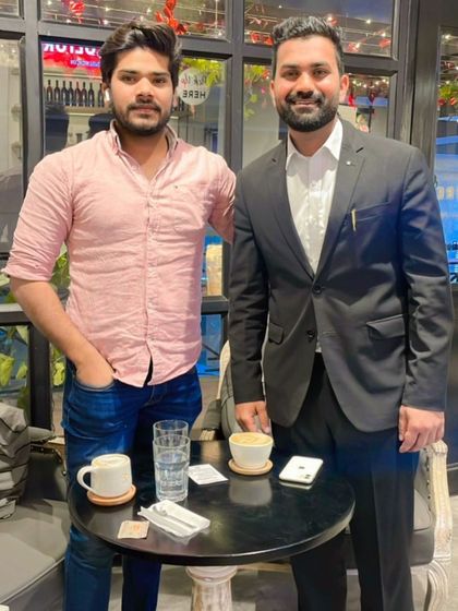 Meeting with a friend or associate. I believe success is not an accident; it is the result of hard work, persistence, and building strong connections.